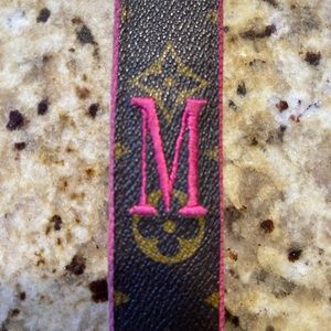 Authentic upcycled Louis Vuitton leather keychain with “M” in hot pink